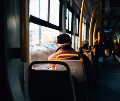 Interior of a city bus with yellow holding rails